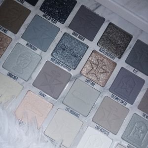 Jeffree Star CREMATED pallette with all white throw blanket.